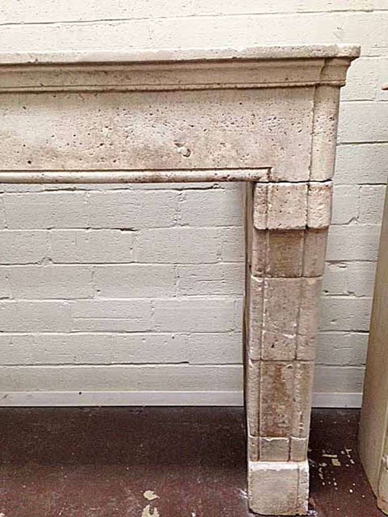 Large limestone mantel imported from France.