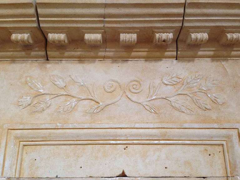 Louis XVI limestone mantel. The trumeau has an Olive branch motif as well as rosettes on the corners.
Firebox measurements: 52