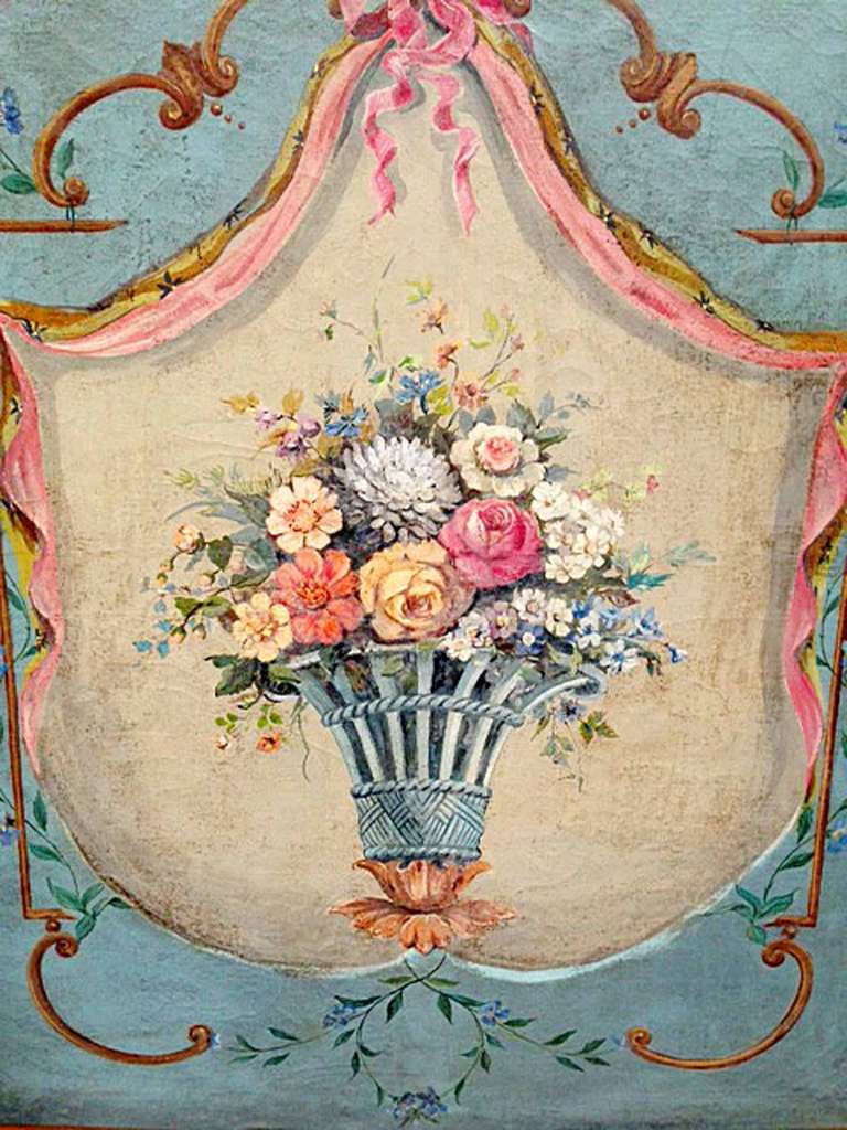 Wood framed hand-painted fireplace screen of flower bouquet. Carvings in wood frame reflect a ribbon on the top and flower designs on each corner.