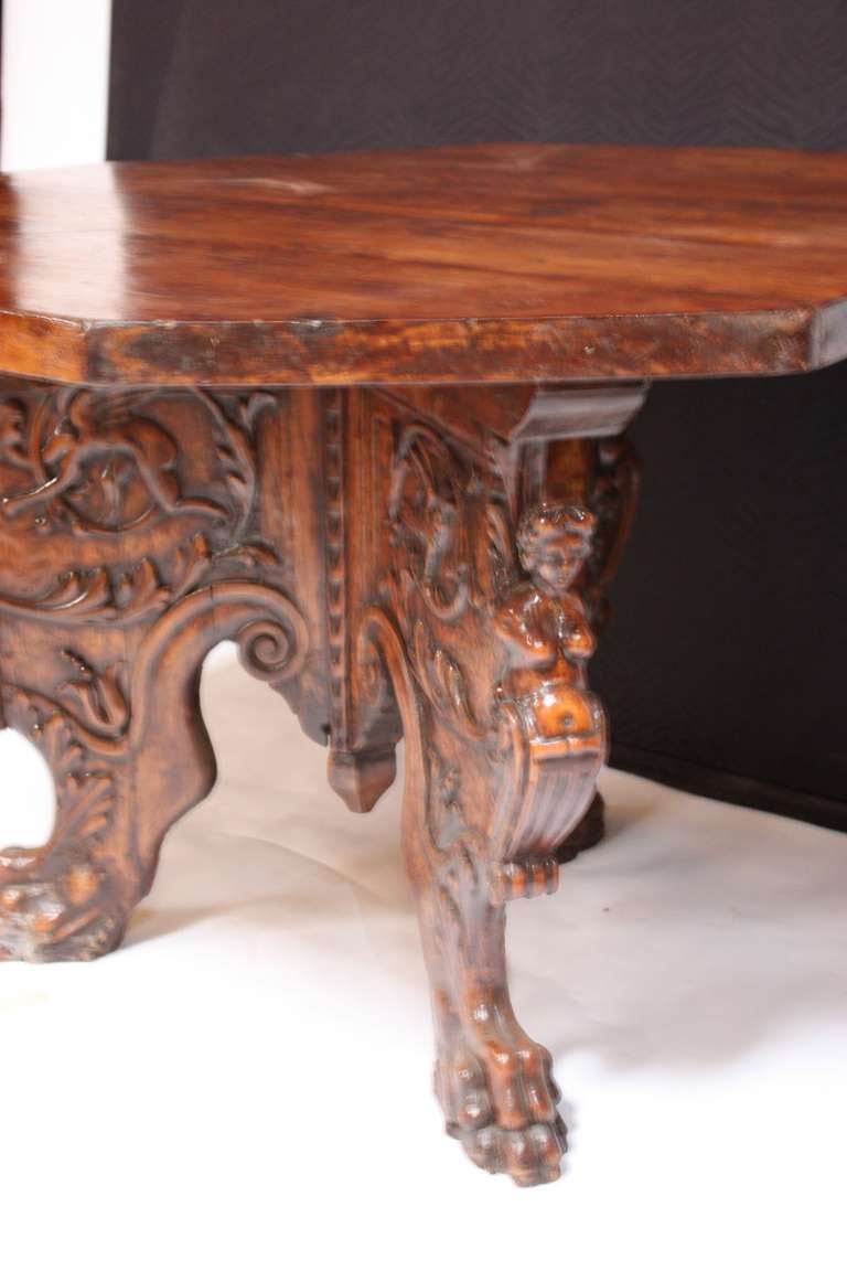 An 18th century Walnut center table with shaped slab base circa 1750.