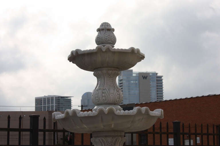 A beautifully carved Carrara marble fountain complete with three tiers and solid marble base.