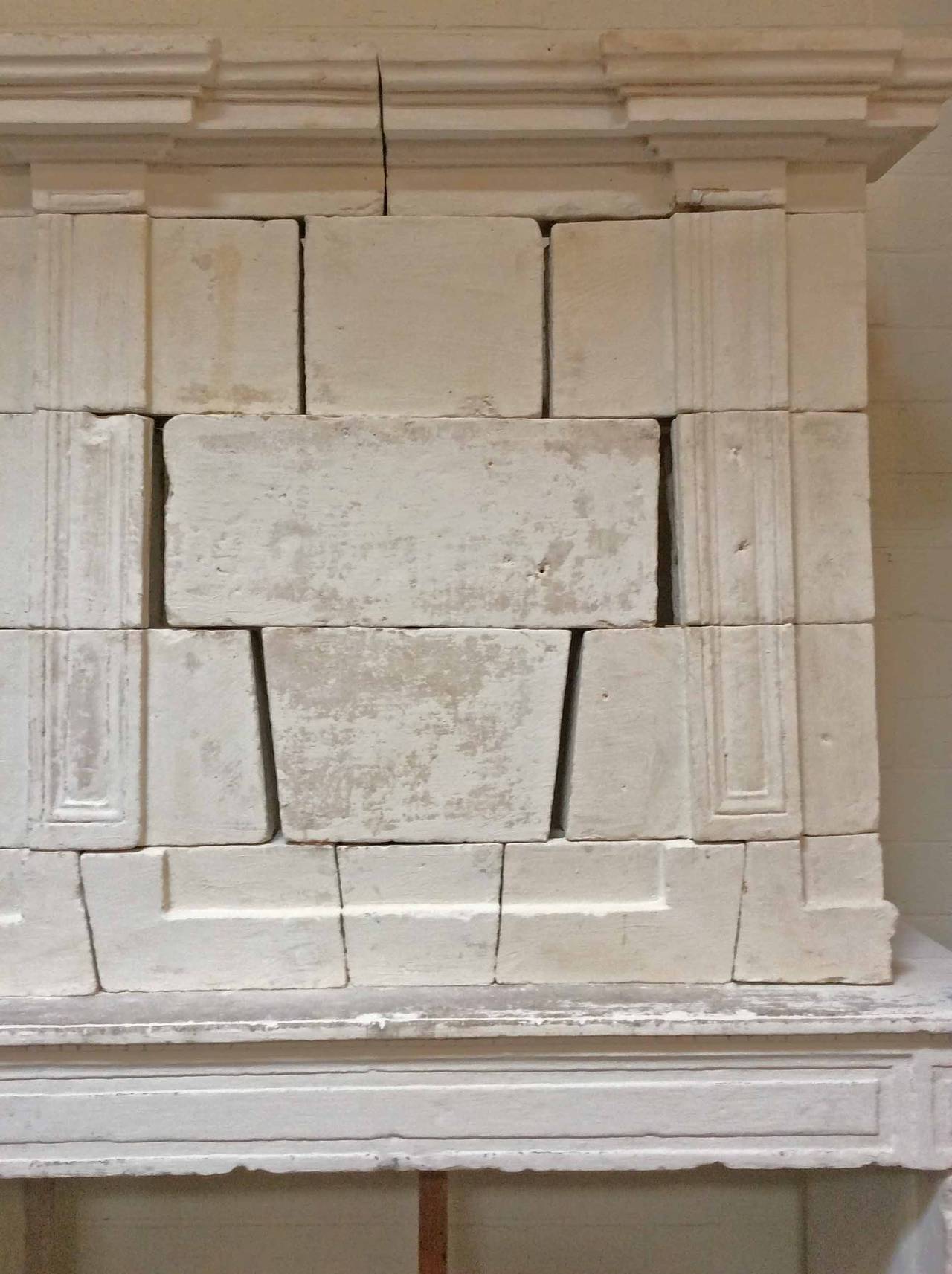 Louis XVI antique limestone mantel.

Origin: France,

circa 1750.

Measurements:
64″ W x 21″ D x 99″ H.
Firebox: 51″ W x 42″ H.