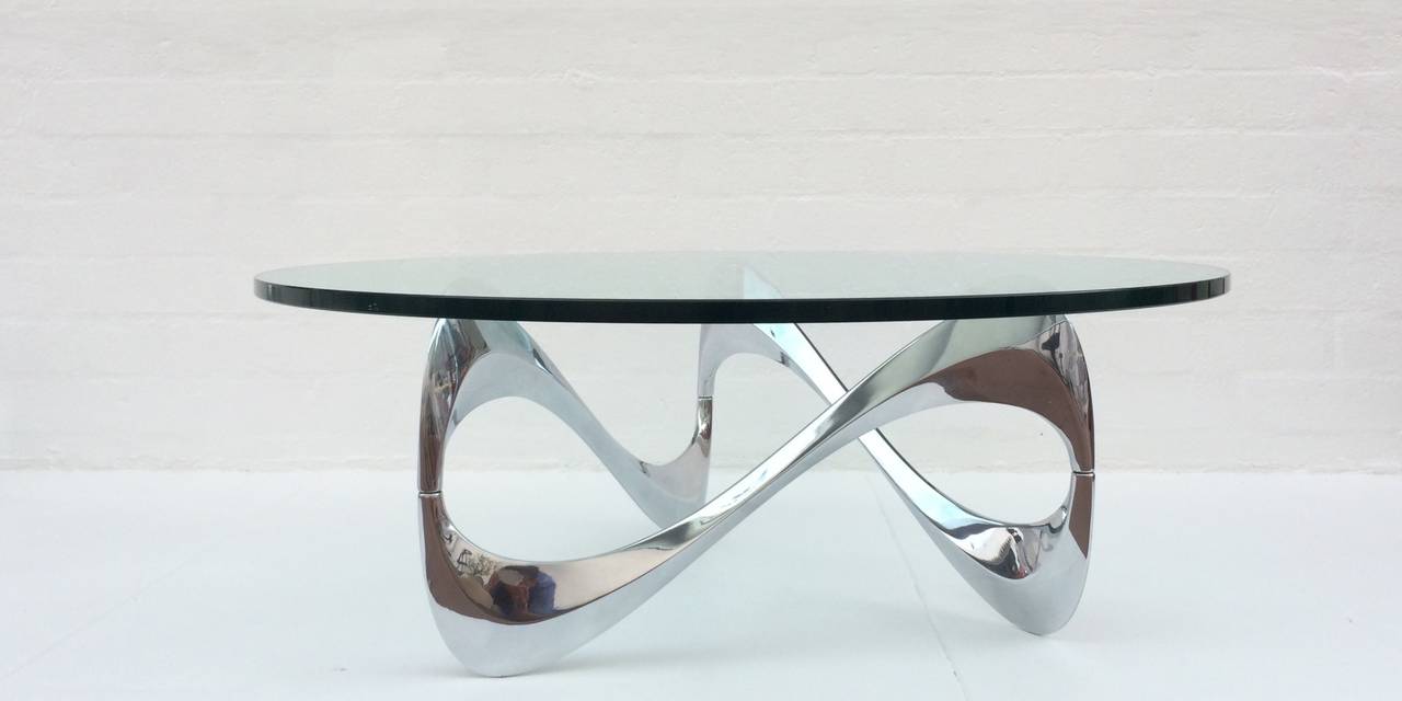 Polished aluminum cocktail tables with 42 inch diameter and 3/4 inch thick glass tops.
The 