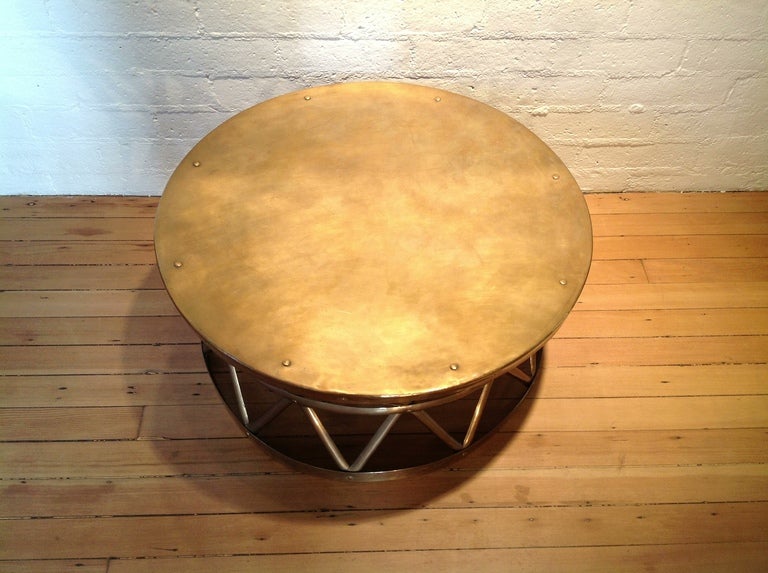 A Vintage solid brass drum cocktail/coffee table.
Shaped like a drum with cross-hatch weave forming the bottom base.
 