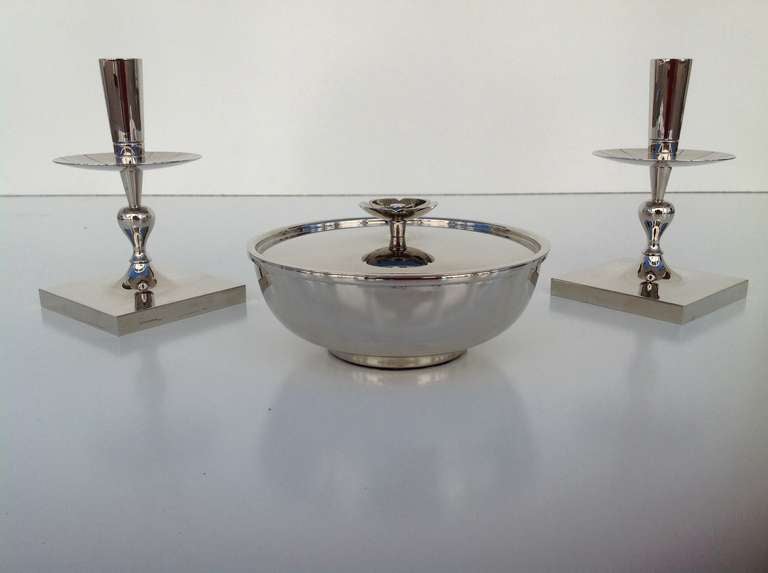 Stunning three piece table garniture set featuring a dish with lid and a pair of candlesticks, designed by Tommi Parzinger.

Dish is 7