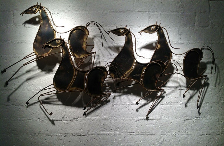 A Gorgeous signed Curtis Jere sculpture of running horses.
Dated 1969
This sculpture has a very patina with a  brass to dark finish.

