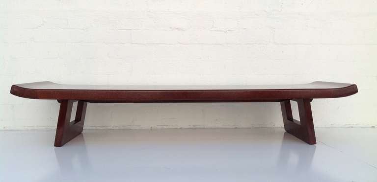 A stunning cork & mahogany bench designed by Paul Frankl in the 1950's