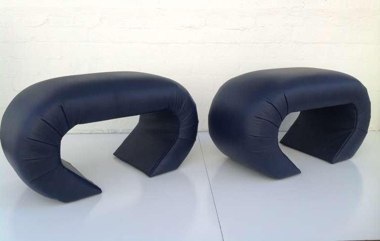 A pair of newly reupholstered benches in the style of Karl Springer.  Midnight blue leather.