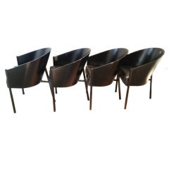A set of four black on black Costes chairs by Philippe Starck