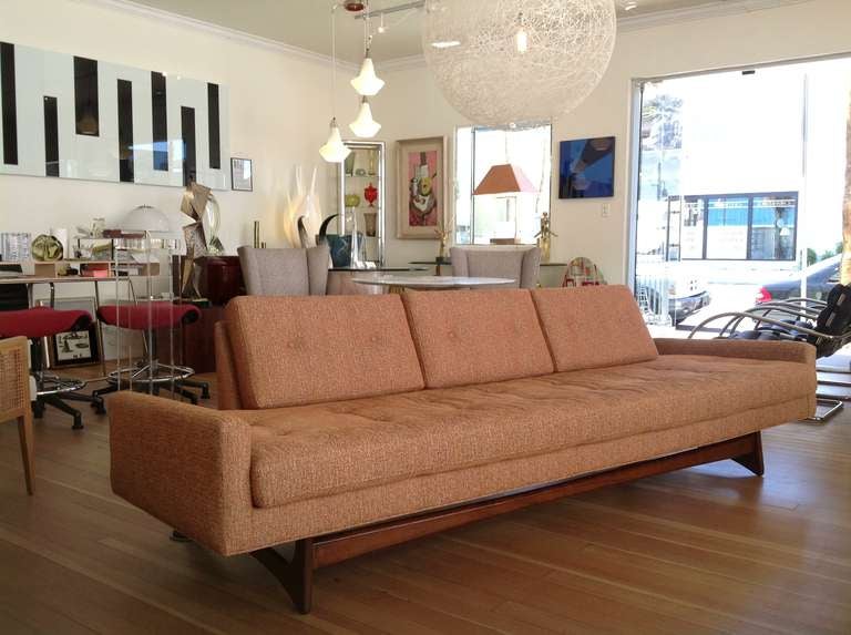 An Adrian Pearsall sofa in original fabric.
This very sculptural sofa floats on a walnut base.

