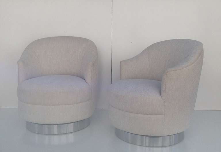 A pair of Karl Springer Swivel Chairs 3