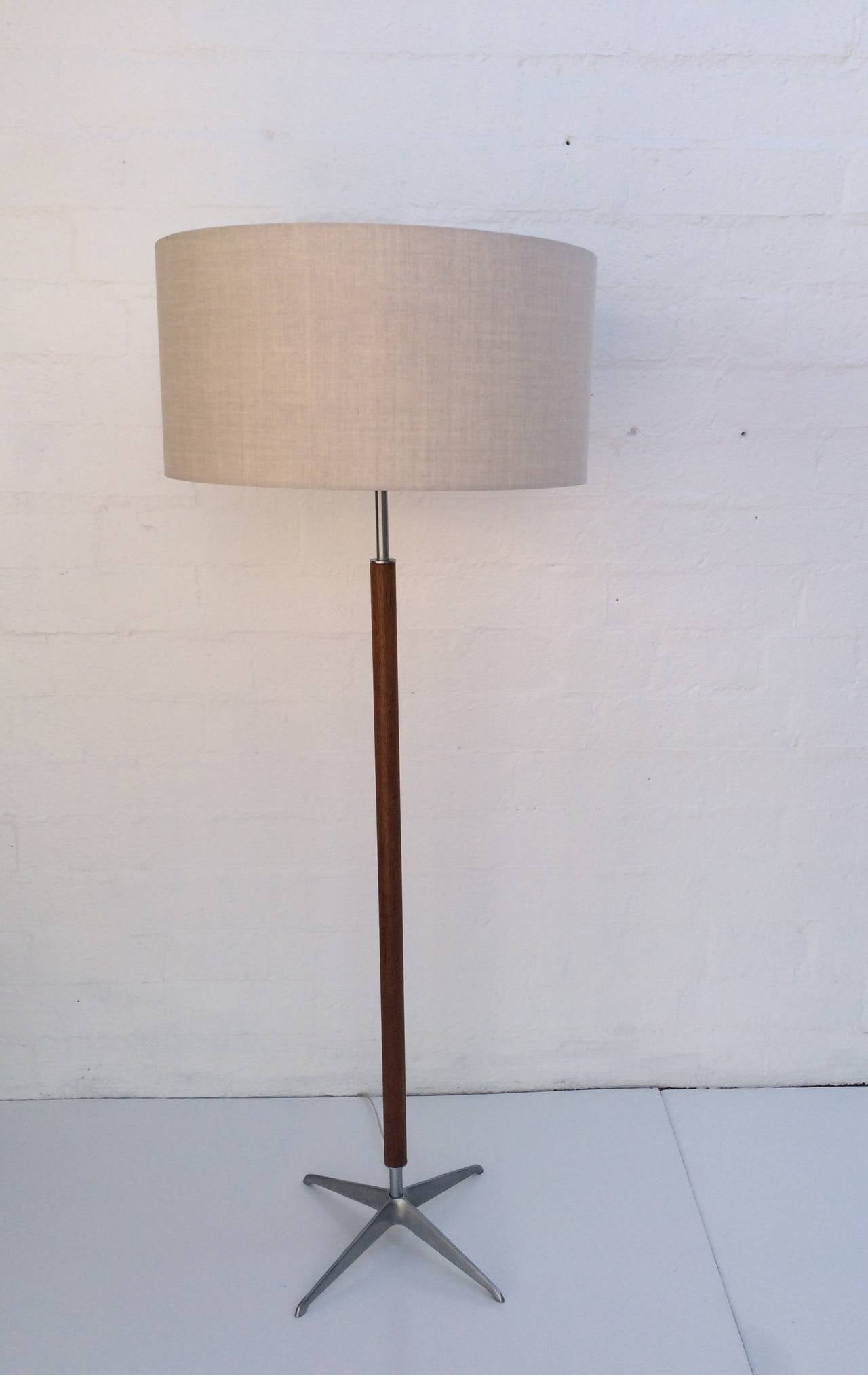 Sophisticated floor lamp designed by Gerald Thurston for Lightolier.  
Brushed aluminum and walnut. 
Newly rewired. 
New oatmeal colored linen shade.