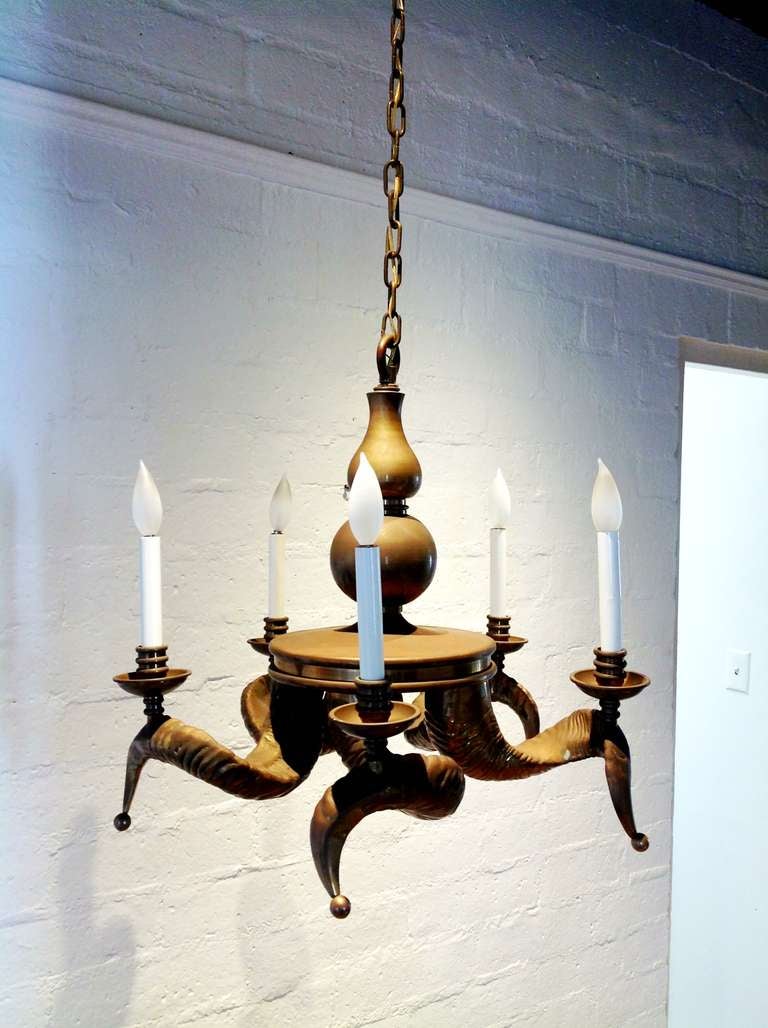 This stunning chandelier has five solid brass horns with candle style lights.
 Made by Chapman
 Newly rewired.
We have left the patina as it it, but we can have it polished if the buyer want it so.