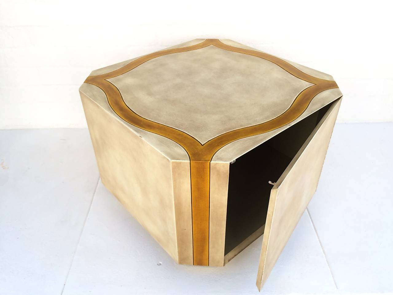 A bedside cabinet designed by Phyllis Morris. 
The hidden door is opened by pushing it to reveal storage. 
Signed Phyllis Morris on the inside, 
circa 1960s.