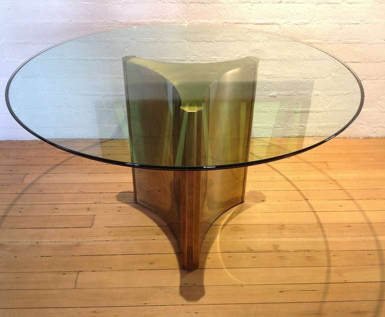 A Mastercraft triangulate pedestal brass base dining table.
48