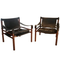 A pair of Rosewood  Arne Norell  "Safari" Chairs