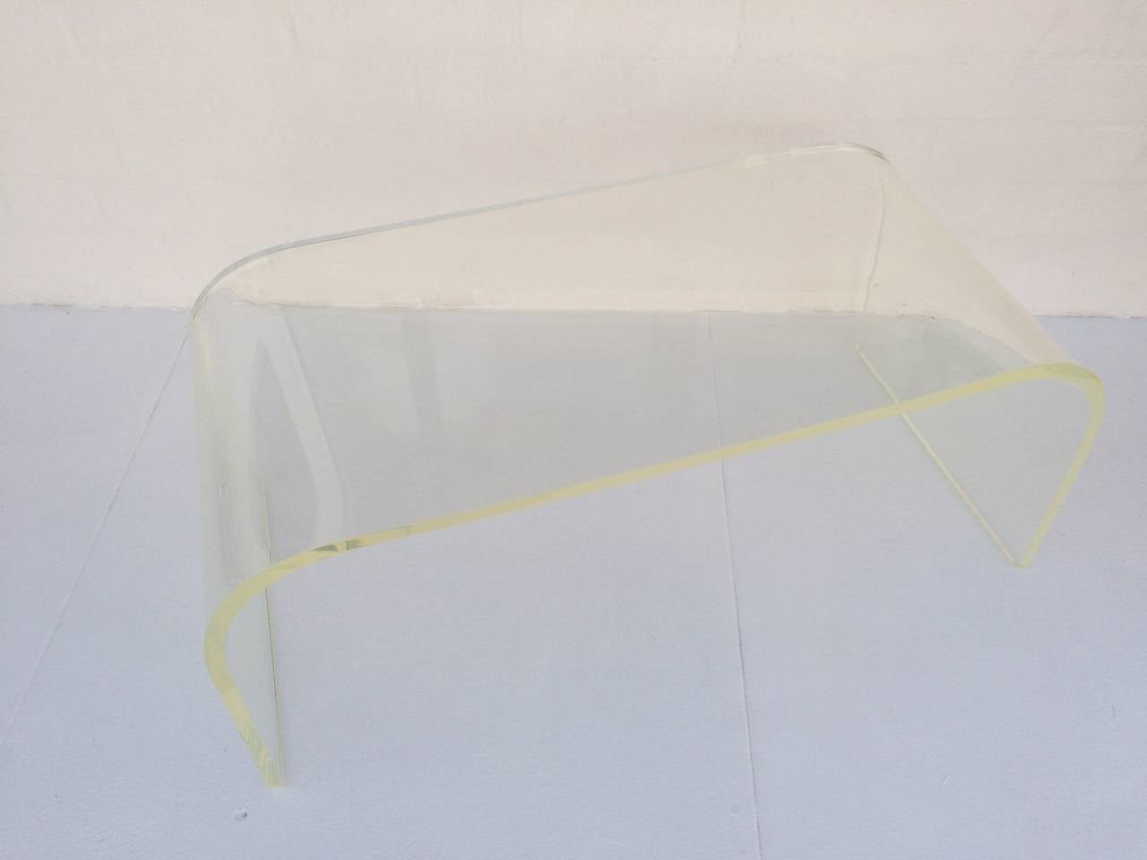 This newly professionally polished acrylic coffee or cocktail table is signed and dated. 