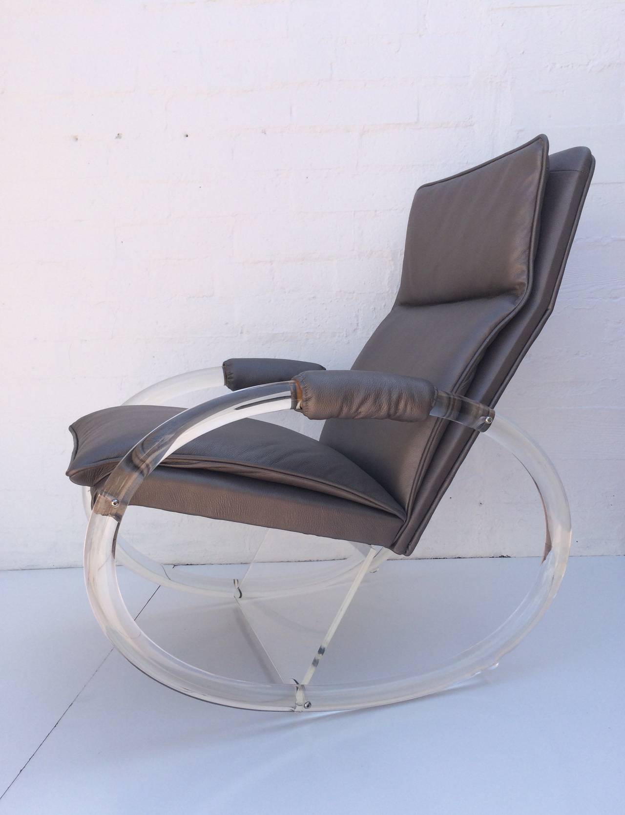 An iconic acrylic rocking chair designed by Charles Hollis Jones, circa 1970s. 
Newly reupholstered in a soft gray leather and newly professionally polished.