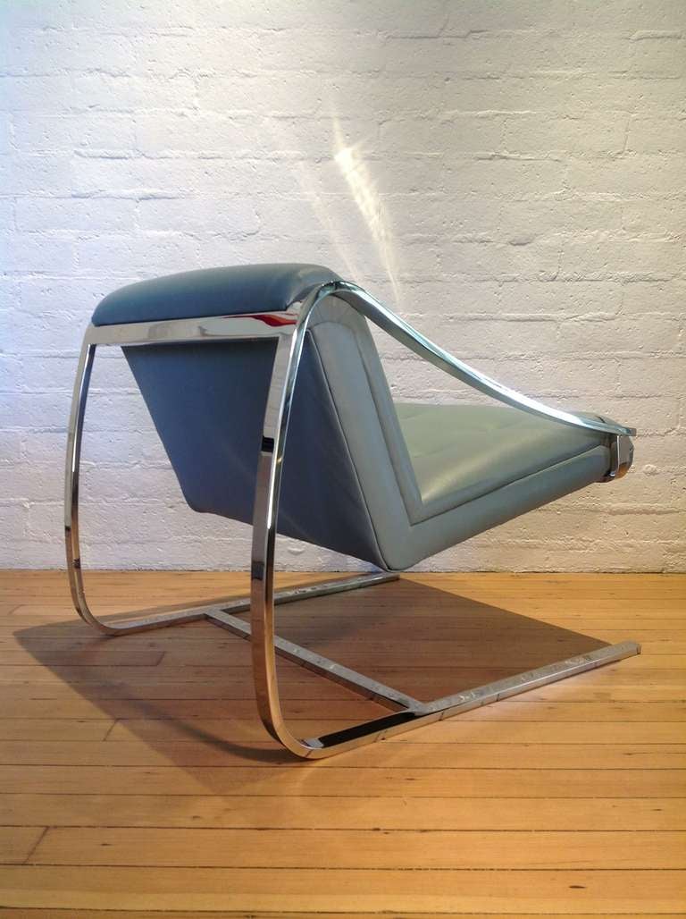 A stainless steel frame lounge chair by Brueton, newly recovered in a soft blue leather.