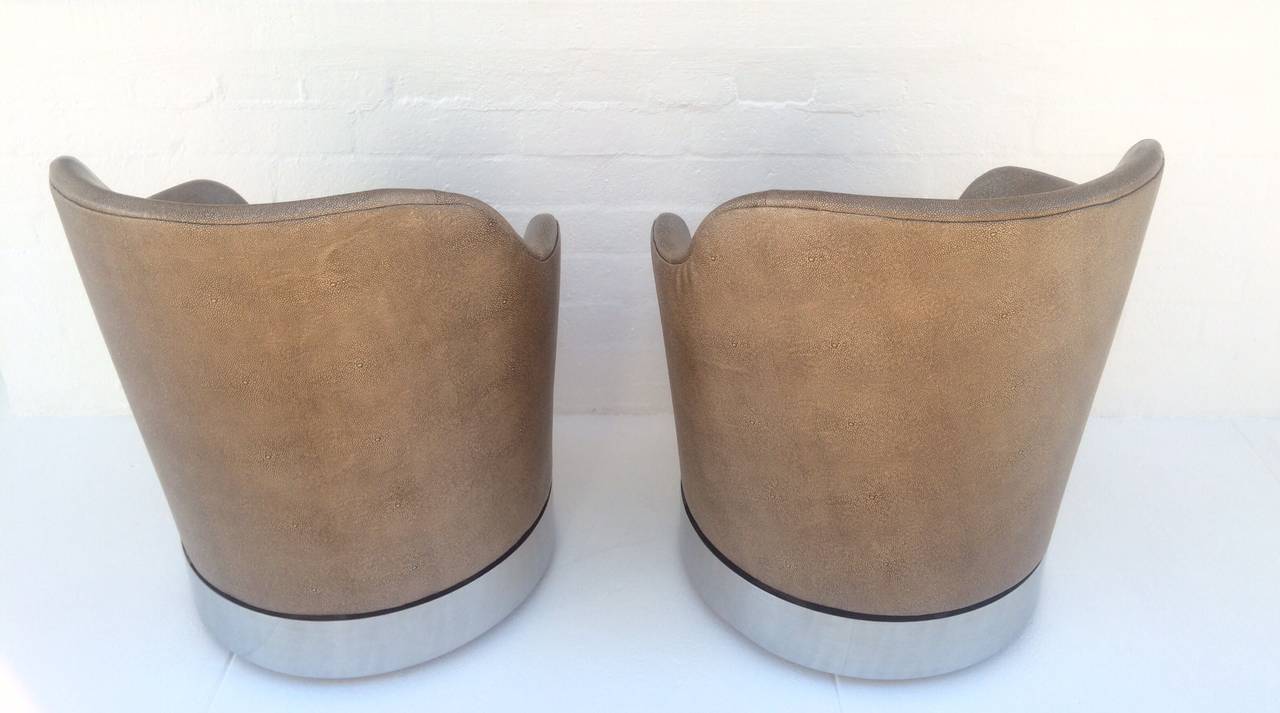 Polished Swivel Lounge Chairs Designed by Phillip Enfield For Sale