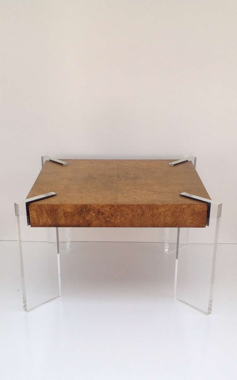 A stunning occasional table consisting of a burl wood top with four acrylic legs that slot into the corners.