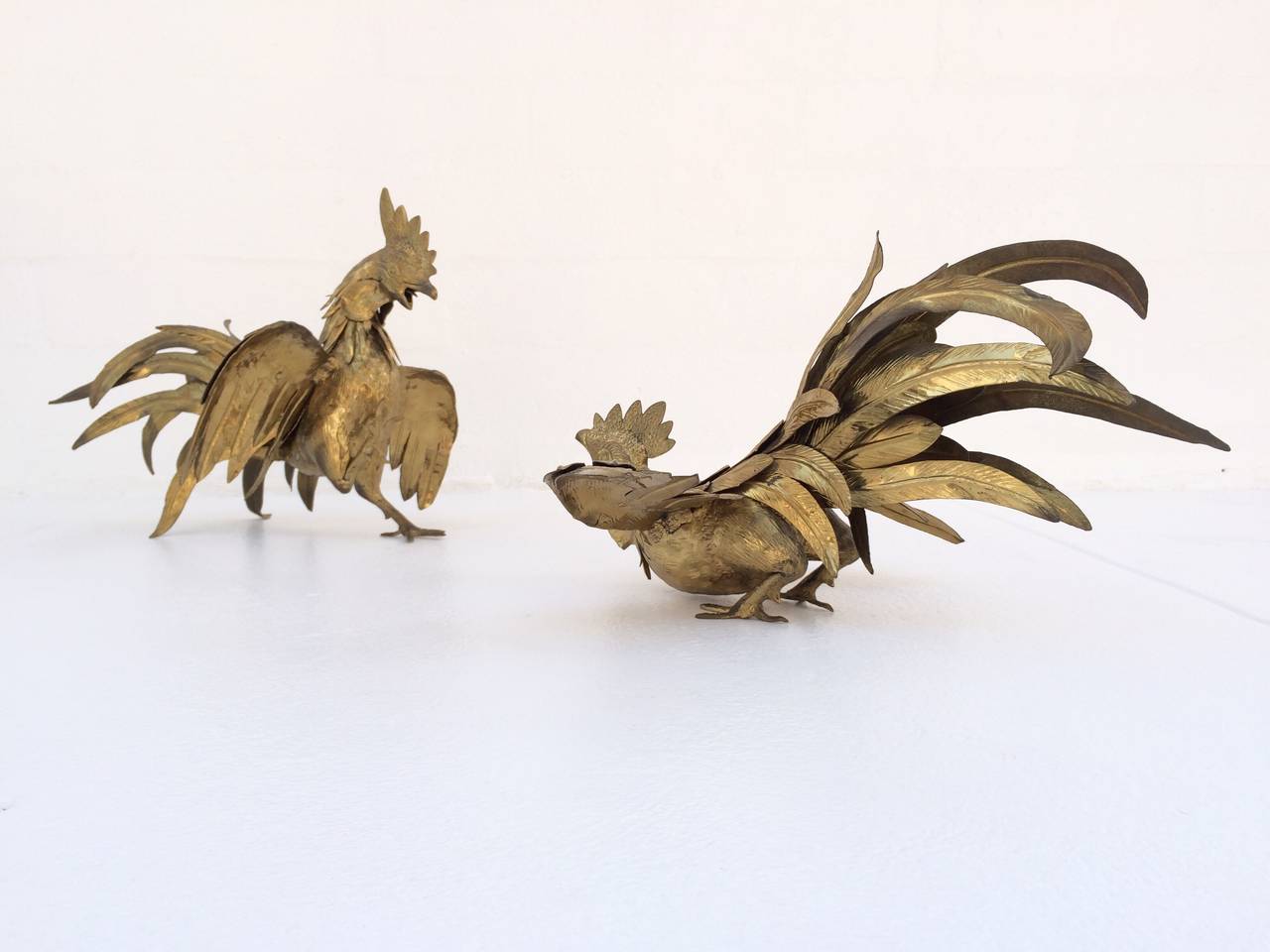 These fighting roosters are made of solid brass and have a very nice weight to them with great attention to detail. 
Made very much in the style of Melani Mario of Italy. 
Both are marked 