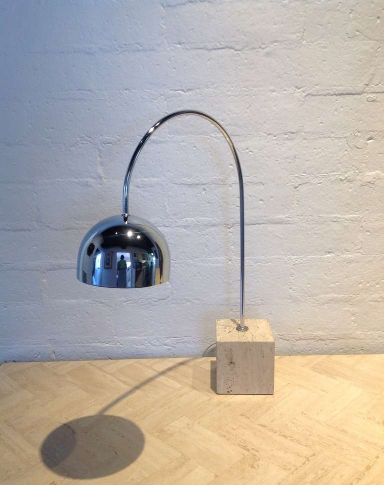 Arc table lamp designed by Guzzini 
This chrome arc table lamp has a travertine square base.
Newly rewired.