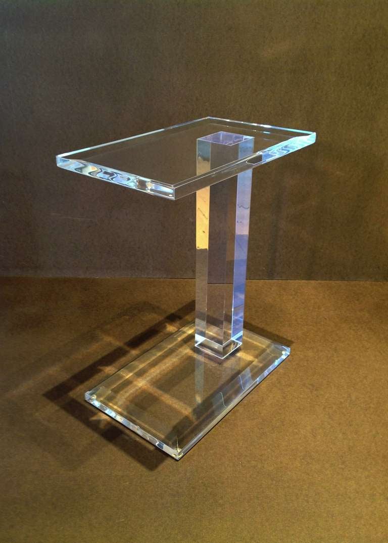 An elegant acrylic side table with clean lines.
This table is the perfect companion to any chair.
The designer is not known, but It came out of a Palm Springs Estate with a lot of Karl Springer and Charles Hollis Jones furniture.