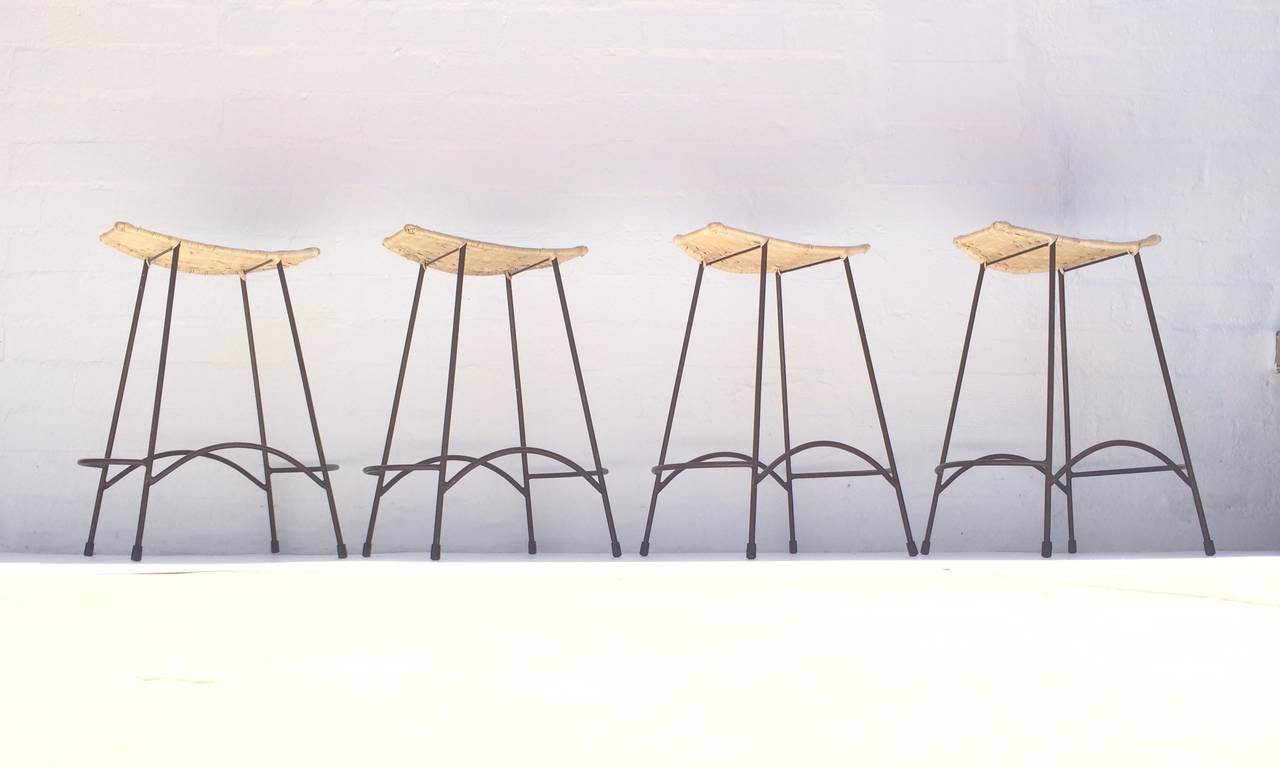 Mid-Century Modern Set of Four Wicker and Painted Steel Stools Designed by Arthur Umanoff