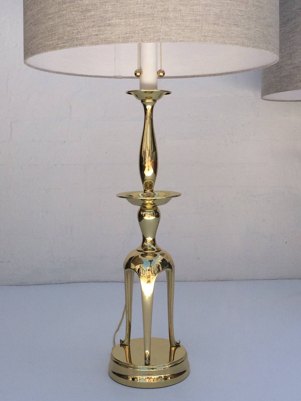 Mid-20th Century Pair of Polished Brass Chapman Lamps in the Manner of James Mont For Sale