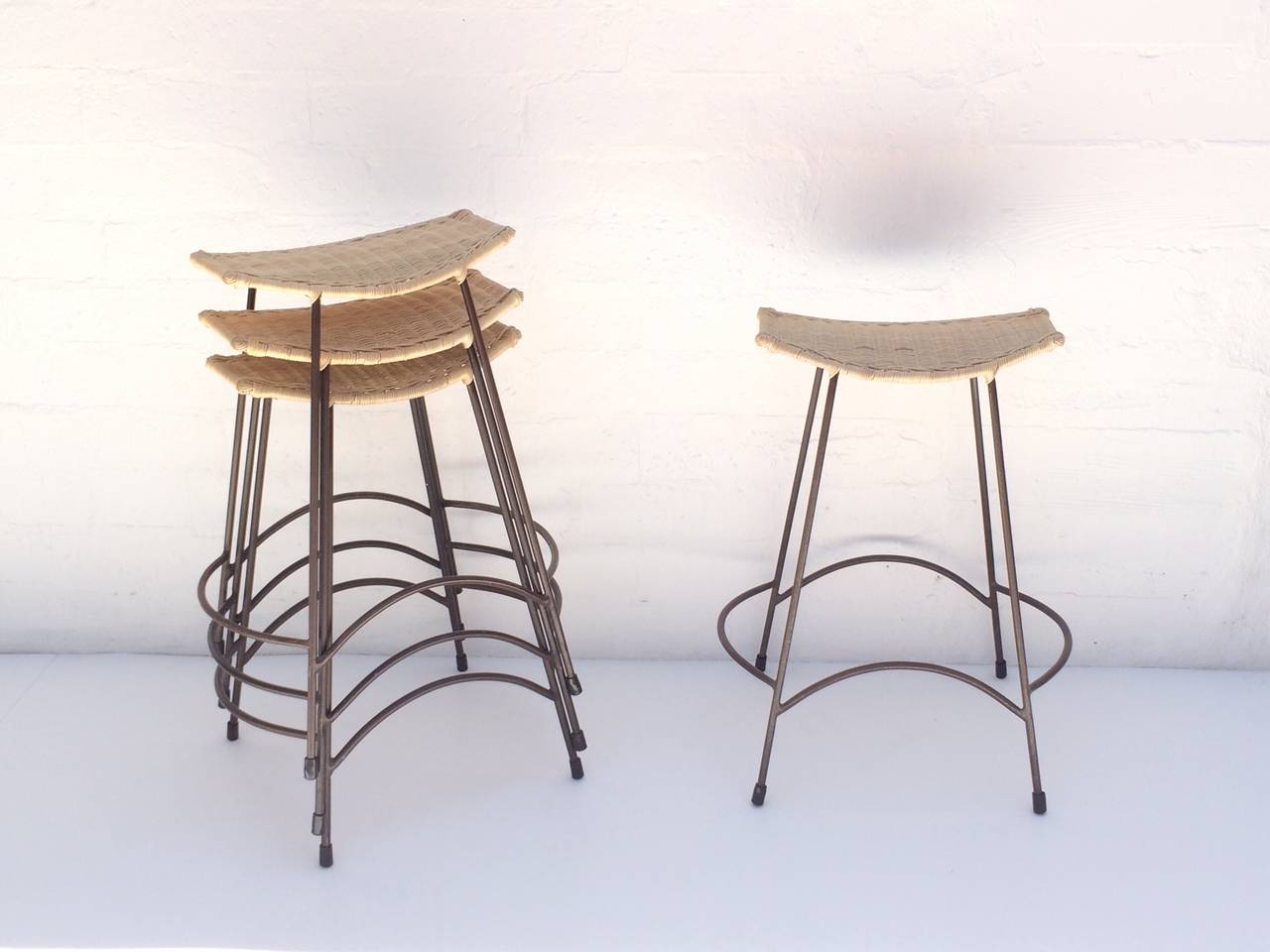 Set of Four Wicker and Painted Steel Stools Designed by Arthur Umanoff In Excellent Condition In Palm Springs, CA
