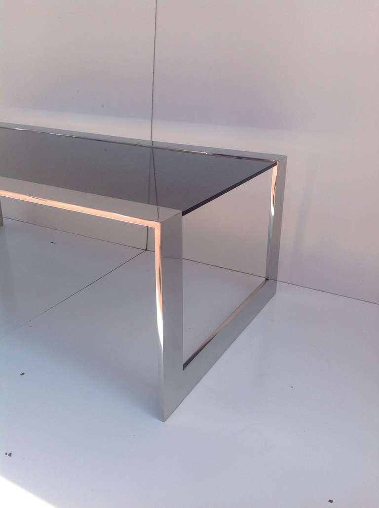 American Smoked Glass and Polished Stainless Steel Coffee/Cocktail Table by Brueton For Sale