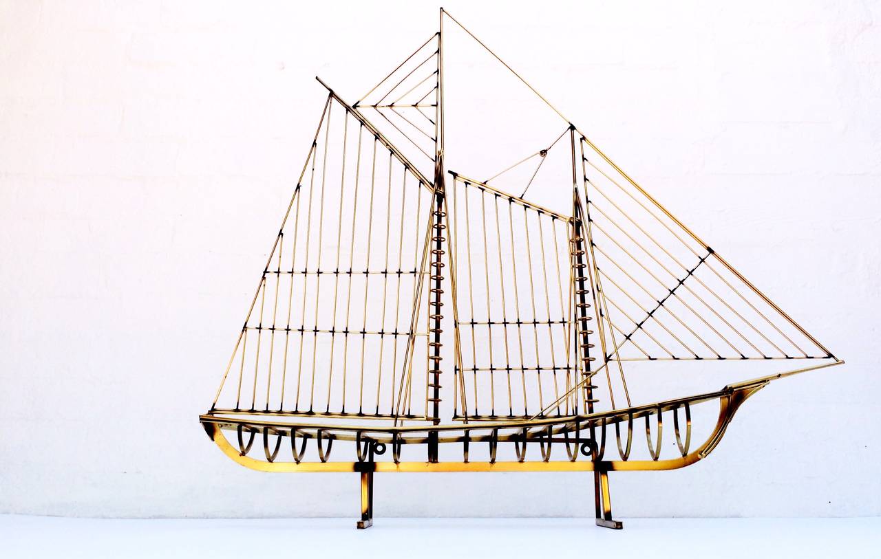A large scale ship made by Curtis Jere,
circa 1970s. 
This brass ship is designed to be freestanding or mounted on a wall.