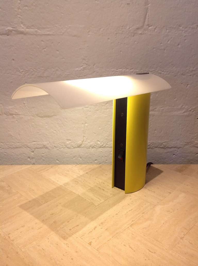 Pair of  powder coated in yellow and black over aluminum desk or table lamps with a white glass shade. 

Made by Koch & Lowy, circa 1980s 

Designed by Piotr Sierakowski