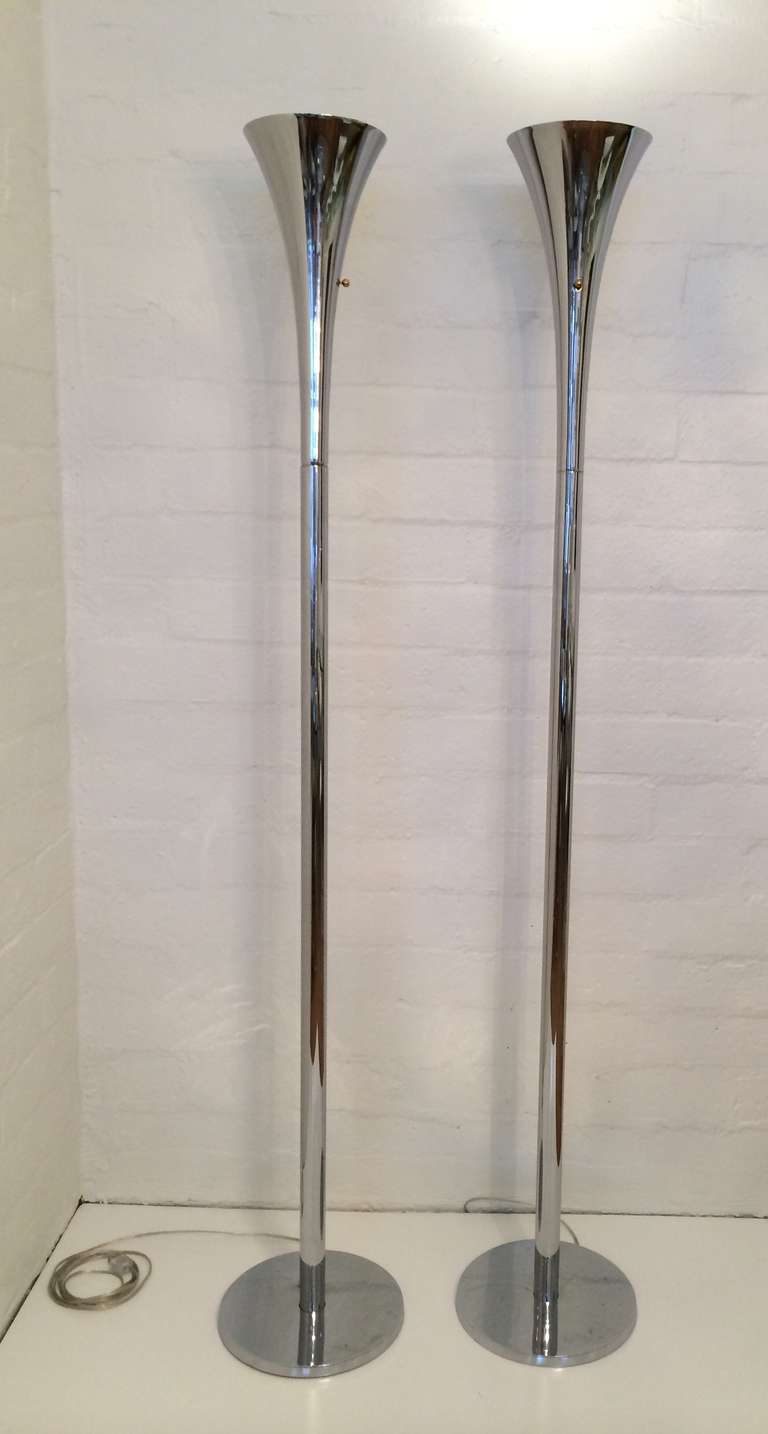 This pair of torcheres floor lamp are newly re-plated in nickel and newly rewired. 
Made by Laurel