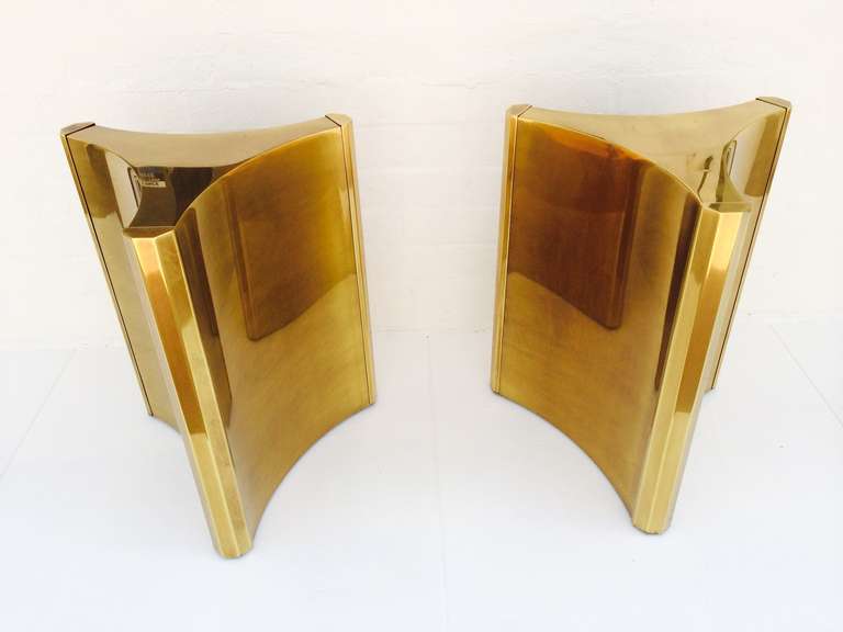 For your consideration a pair of antiqued brass dining table pedestals by Mastercraft.