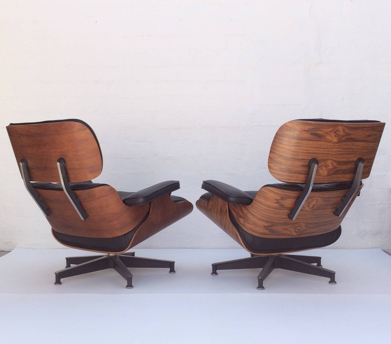 Aluminum Pair of Early Eames Rosewood 670 & 671 Lounges Chairs with Ottomans