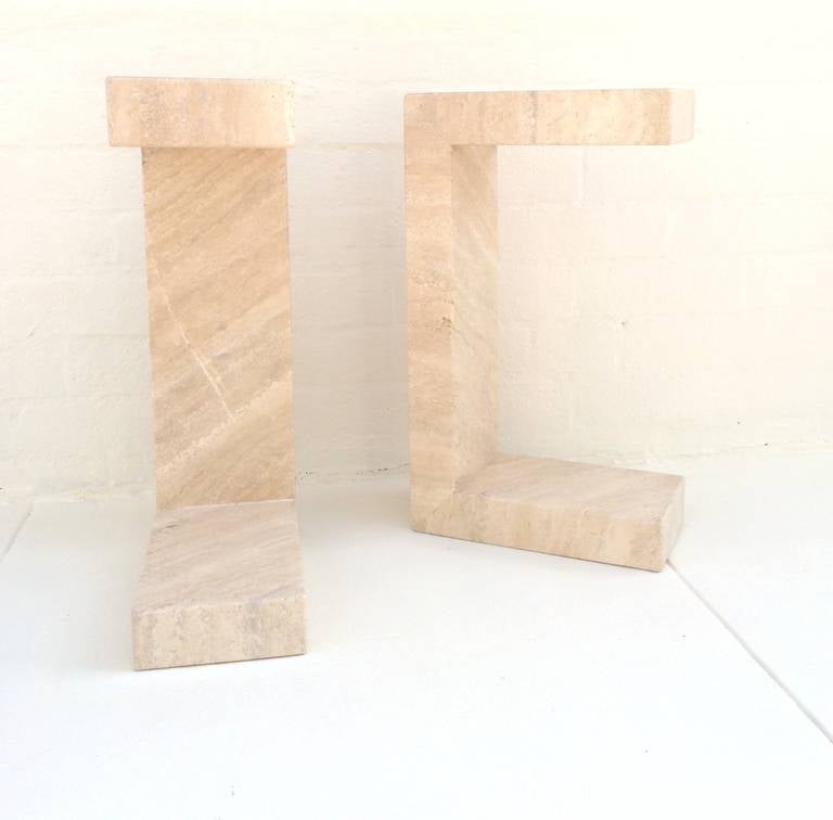 This pair of side tables, or can be used as small benches.
made of solid travertine that has a glossy polished finish.
If used as benches they are  15