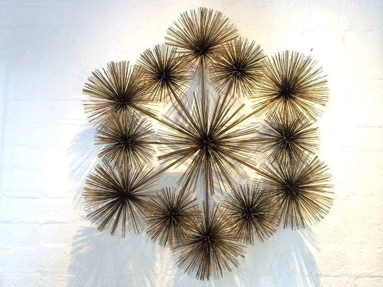 This very large aged brass wall sculpture has thirteen poms, making it more rare, as most only have three or four.
Signed and dated 1977