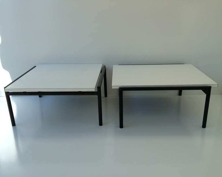 A pair of indoor/outdoor tables designed by Don Knorr for Vista of California. 
White Formica top with black metal bases