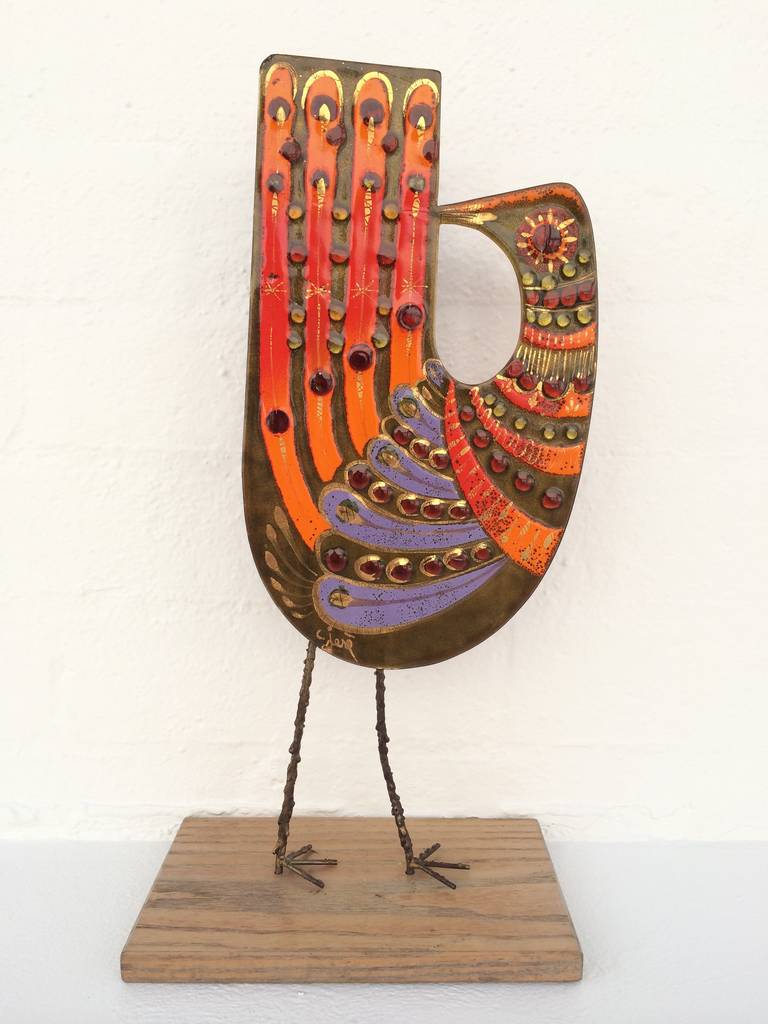 This freestanding bird sculpture is enamel on copper with a wood base.
The vibrant colors make this piece really stand out!
Designed by Curtis Jere (signed)
These hard to find bird sculptures don't show up for sale very often.