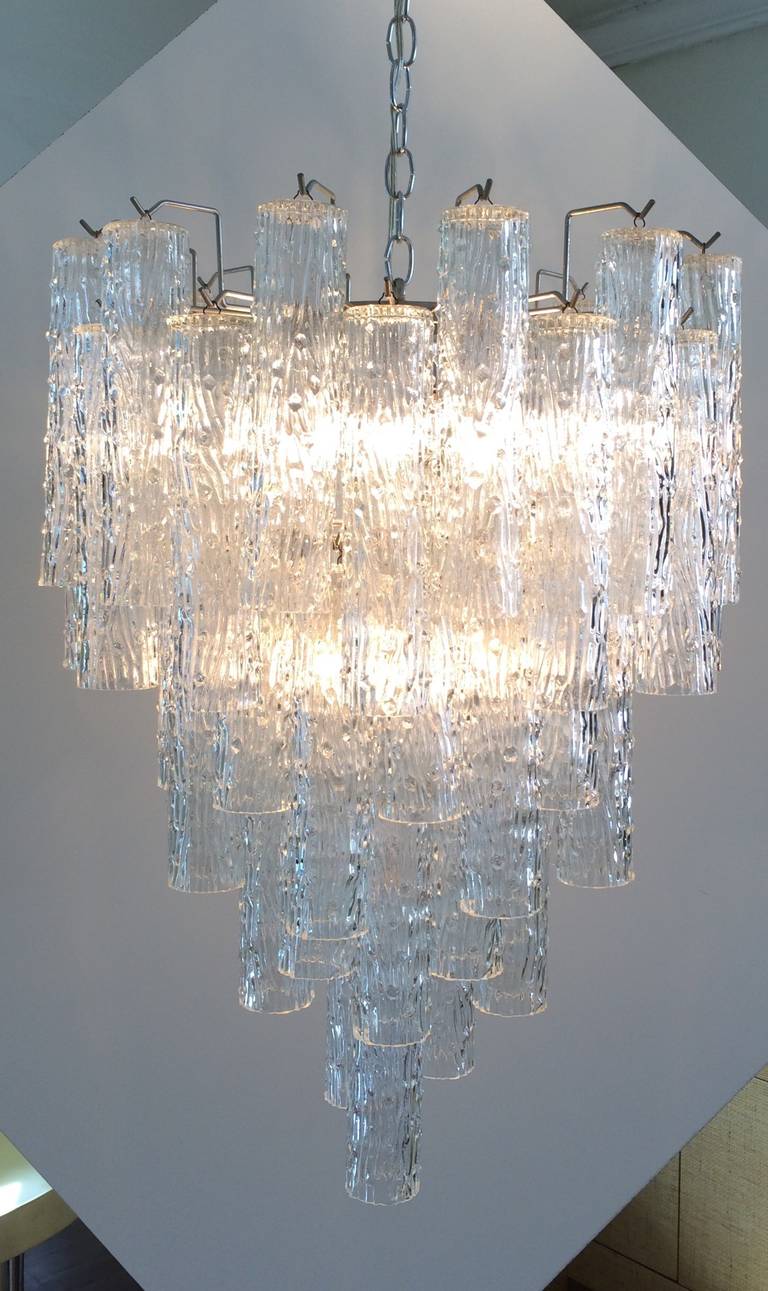 This gorgeous chandelier's tubular glass pieces drops down eight tiers to create a wonderful dramatic statement!