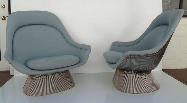 A pair of the highly sought after high-back lounge chairs upholstered in blue fabric by Warren Platner. Originally designed in 1966 and manufactured between 1966-1988.