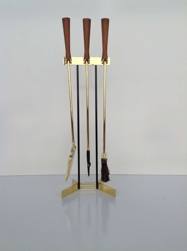 Fireplace tool set from the 1950s.
Walnut handles with newly plated polished brass and black powder coating.