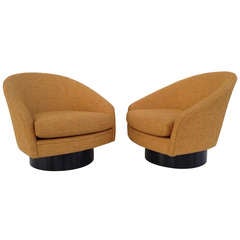 A Pair of Swivel Lounge Chairs by Adrian Pearsall
