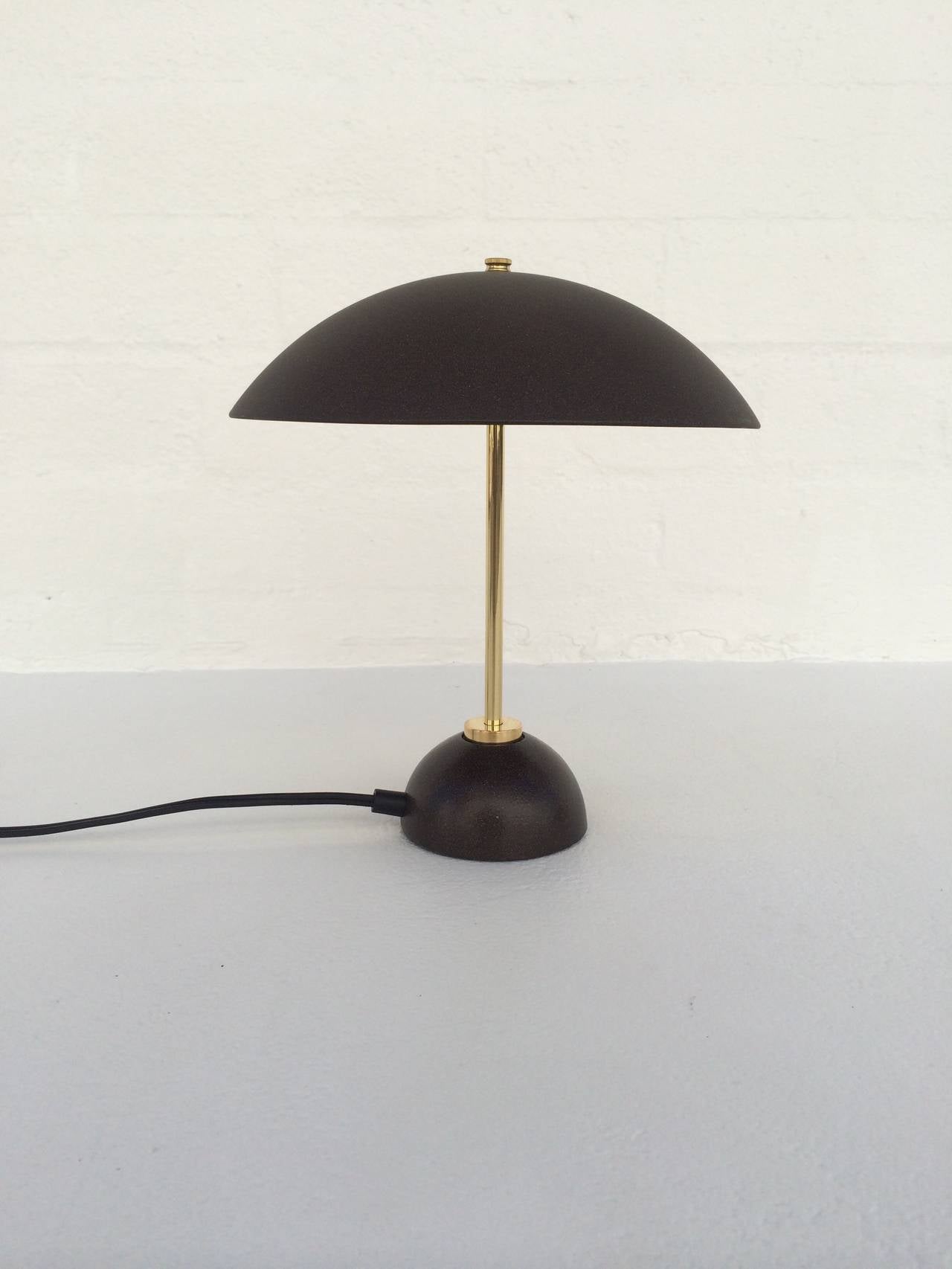 Brass with brown speckled painted metal shade and base. 
Circa 1970s