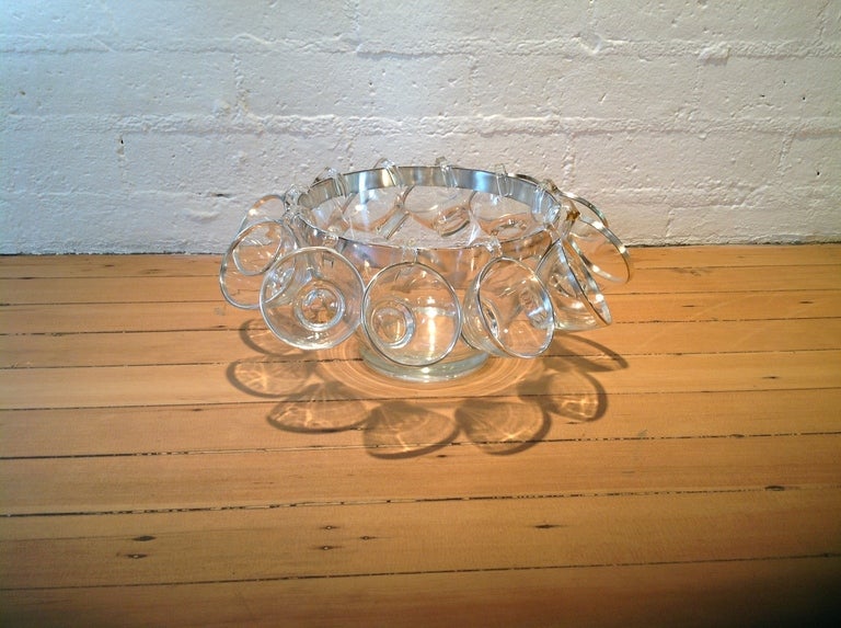 Just in time for the holidays.
A Dorothy Thorpe punch bowl with 12 cups.
The cups are in excellent condition. 
The punch bowl has slight wear on the rim.
