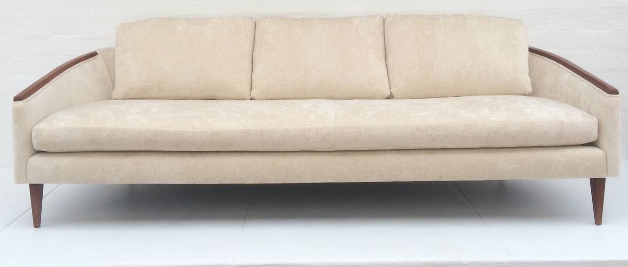 This stunning 1950s sofa is newly reupholstered is a elegant soft chenille style fabric. 
Polished walnut armrest and legs. 
Was purchased from Las Palmas estate in Palm Springs that had all the original 1950s furniture. 
Three loose back