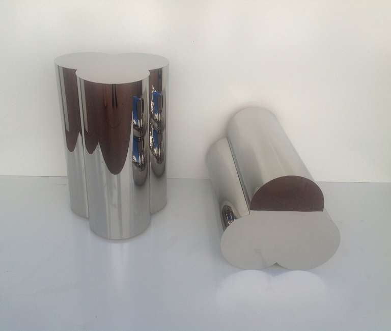 A pair of clover shaped pedestals designed by Curtis Jere' 
These consist of wood bases wrapped in polished chrome.