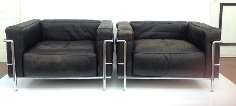For your consideration a pair of Le Corbusier LC3 lounges chairs made by Cassina.  These chairs are rich black leather with polished chrome frames.  The leather has a wonderful worn in look and feel!  Both chairs retain the paper Cassina labels on